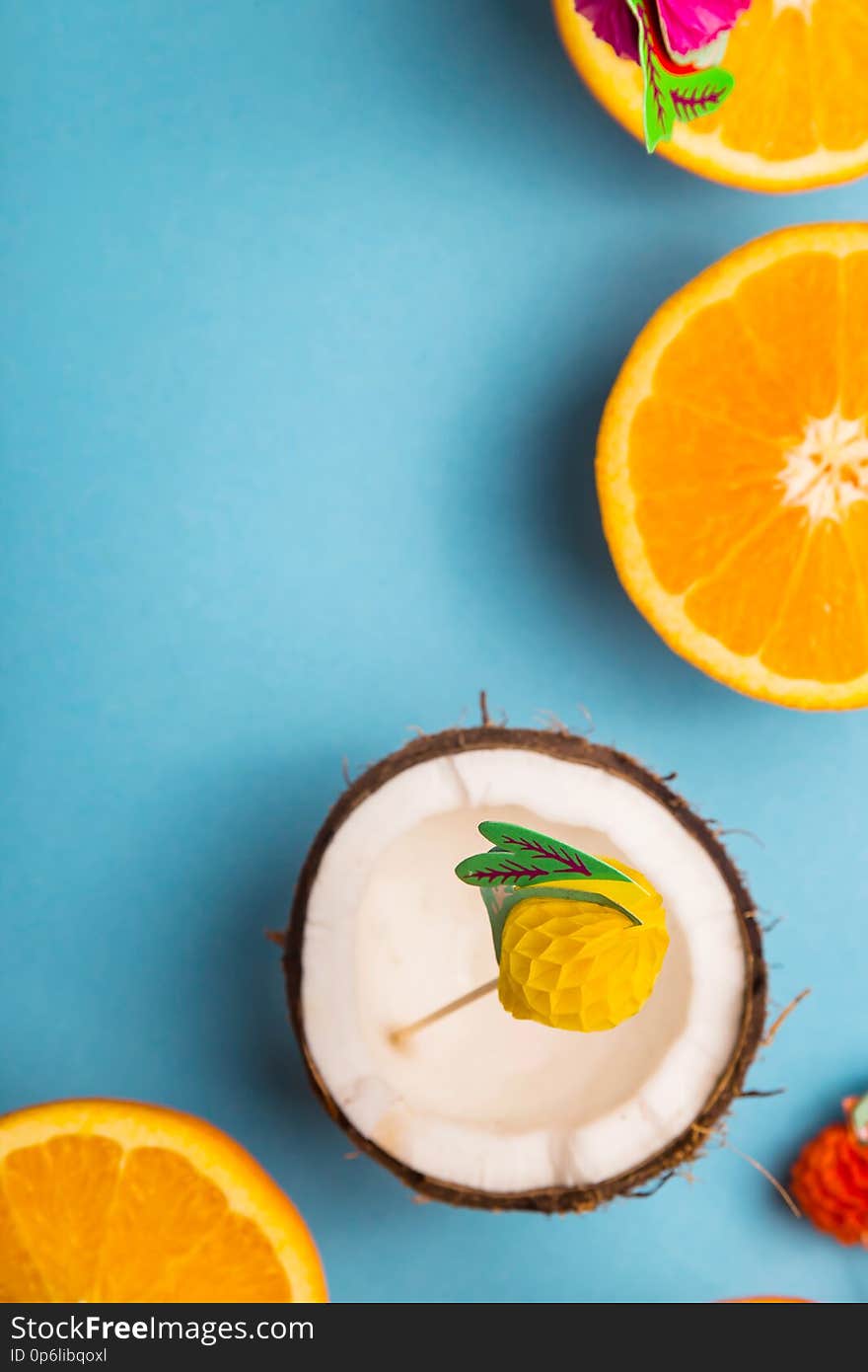 Among the juicy oranges on a blue background. Summer Food Concept. Top view, flat lay, copy space. Among the juicy oranges on a blue background. Summer Food Concept. Top view, flat lay, copy space