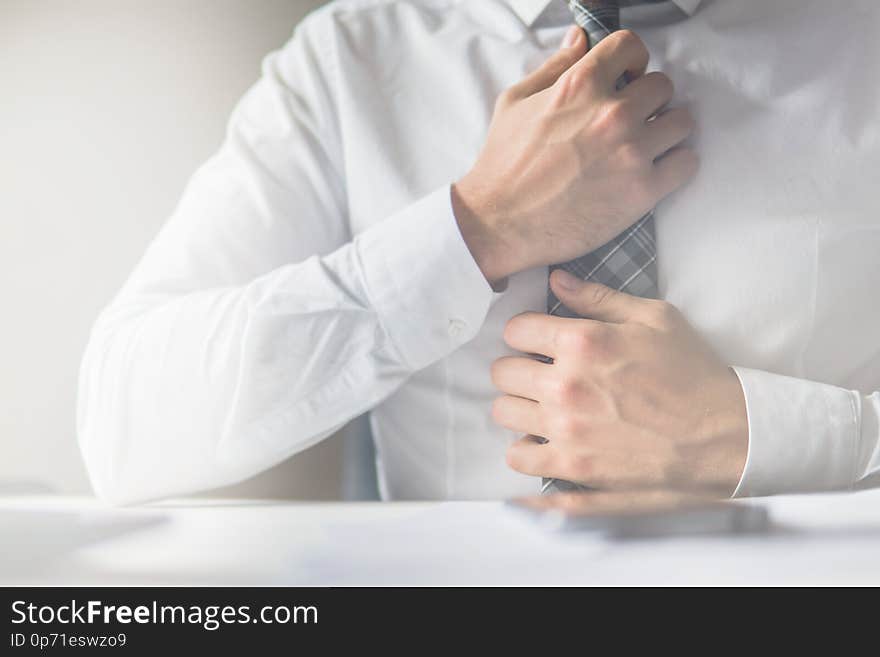 Office work concept. Businessman working with documents. Close up telephone. White background. light leaks