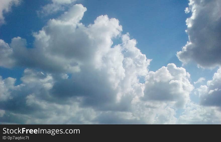 Scenic gorgeous morning March tropical sky with puffy big lighting clouds. Scenic gorgeous morning March tropical sky with puffy big lighting clouds