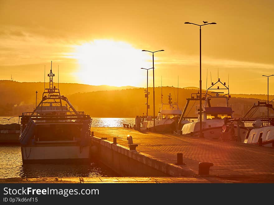 Sunset light in a harbor the Spanish town Palamos in Costa Brava