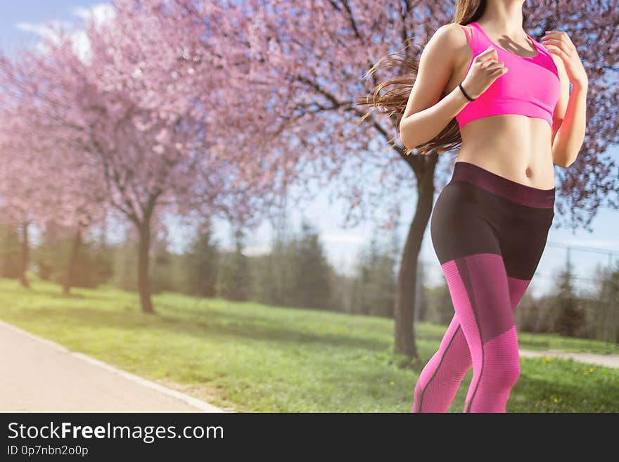 Fitness woman running at park. Fitness woman running at park.