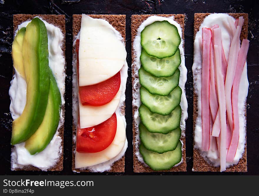 Healthy different rye sandwiches from whole grain rye crispbread. The concept of healthy eating