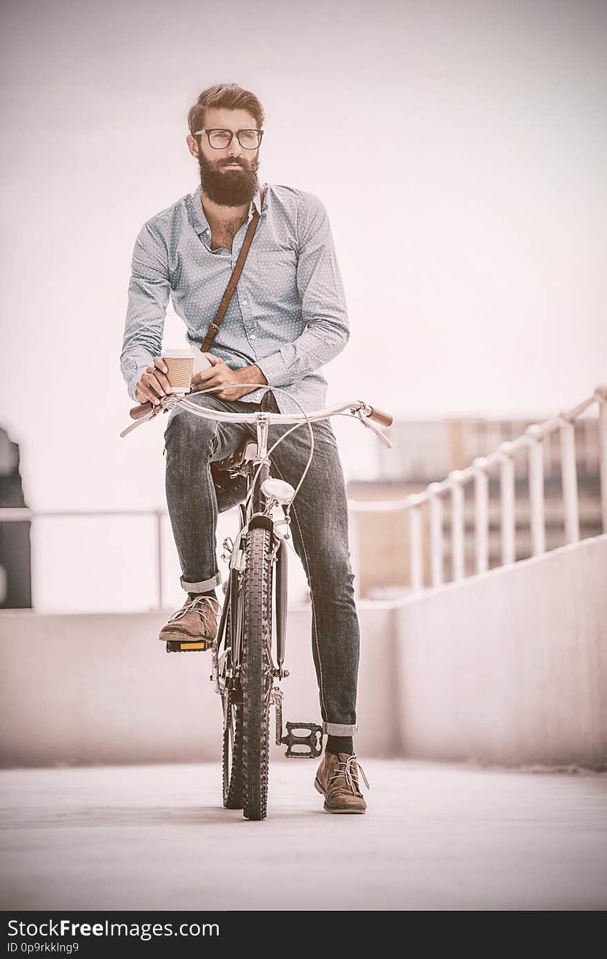 Hipster posing on his bike