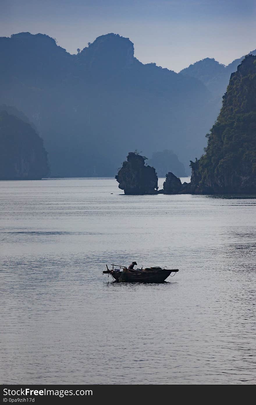 Halong bay in Vietnam. UNESCO World Hege Site asia asian background blue boat cave cliff color cruise ship exotic famous floating green gulf house houseboat idyllic indochina island landscape liner mountain nautical ocean rock scenic sea seascape shed shore sky southeast sunset titop tour travel vessel vietnamese village water