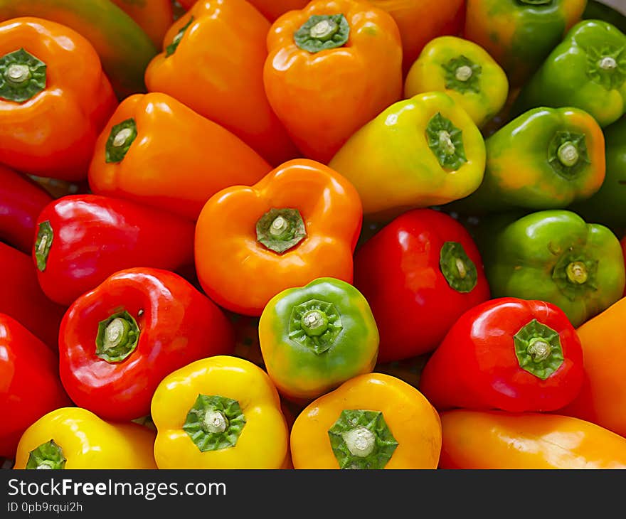 Freshness pepper, Colorful Yellow, orange, green and Red Paprika, Colorful bell peppers on the street market.