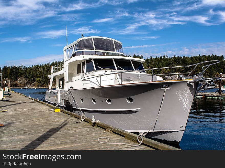 Large grey yacht sitting at a dock on Salt Spring Island. Large grey yacht sitting at a dock on Salt Spring Island