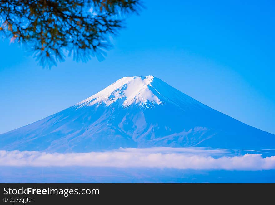 Beautiful landscape of mountain fuji around maple leaf tree with white cloud and blue sky in autumn season at Yamanashi Japan. Beautiful landscape of mountain fuji around maple leaf tree with white cloud and blue sky in autumn season at Yamanashi Japan