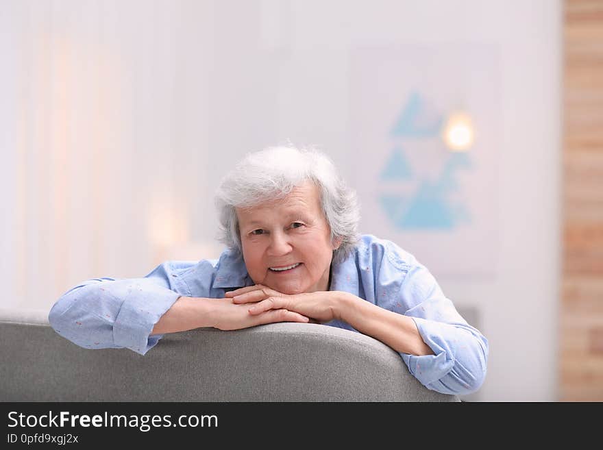 Portrait of grandmother in living room