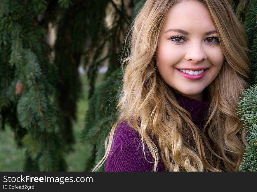 Pretty girl white latino with long blonde hair and curly curls wearing casual clothing for fall autumn fashion lifestyle