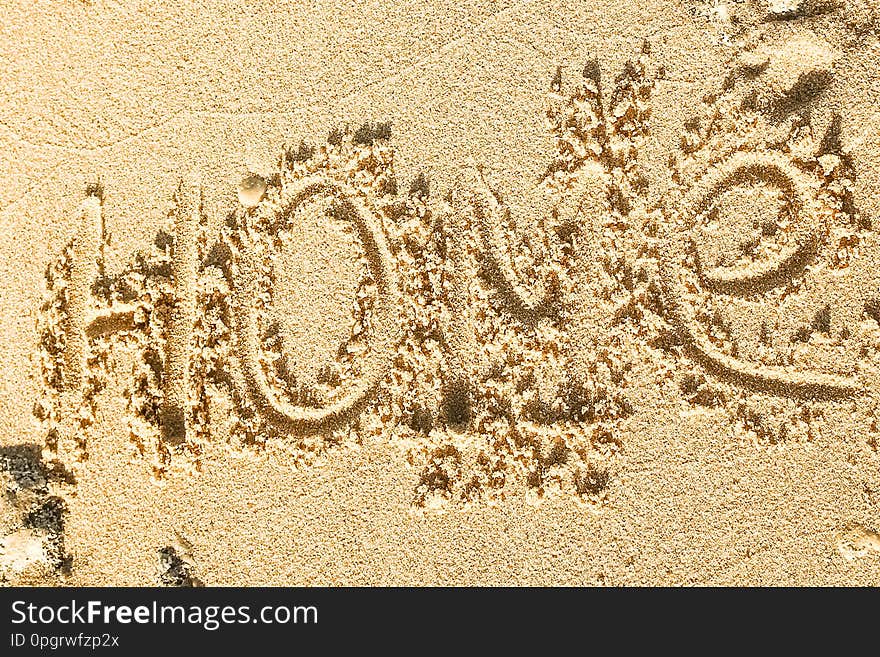 A Beautiful drawing on the sand of the sea background