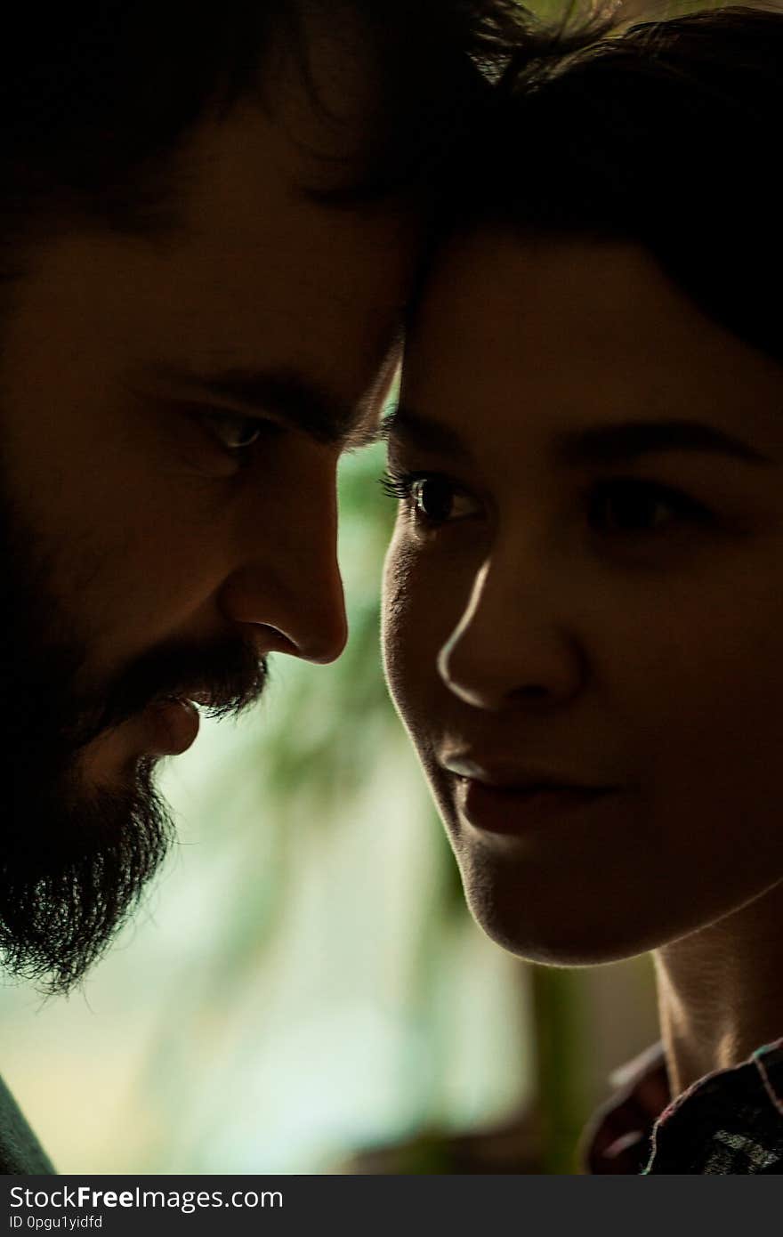 Close portrait of a young couple. Man and women in love. Cling to each other. Vertically framed shot. Close portrait of a young couple. Man and women in love. Cling to each other. Vertically framed shot