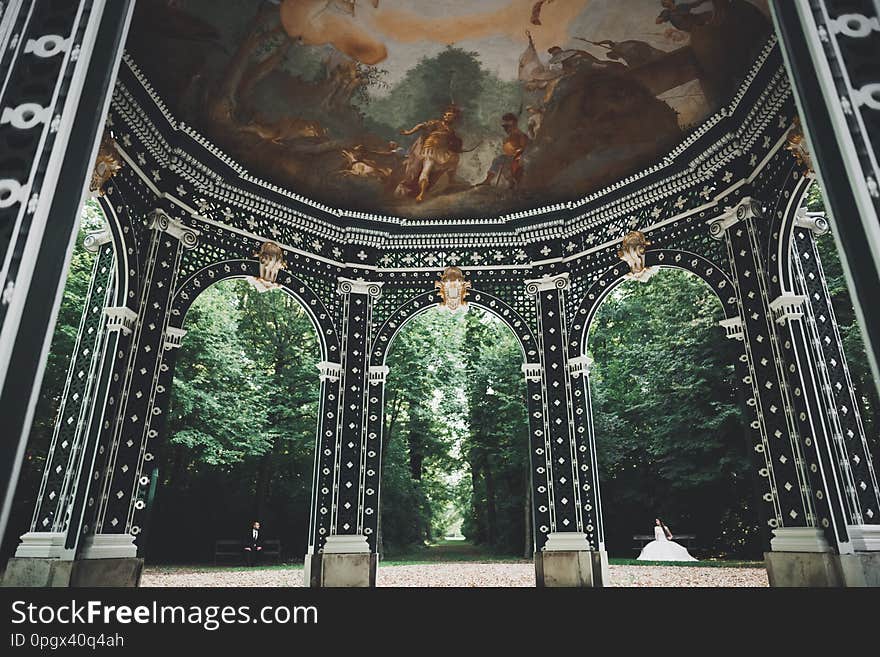 Perfect couple bride, groom posing and kissing in their wedding day