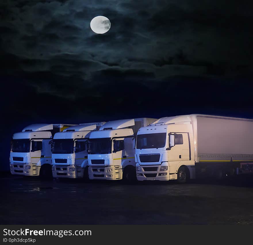 trucks at night in parking lot