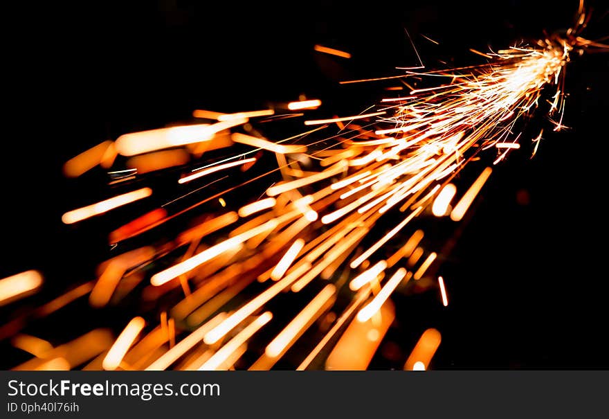 bright sparks of metal against dark background