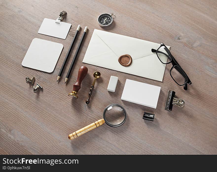 Blank envelope and retro stationery template on wooden background. Mock up for branding identity