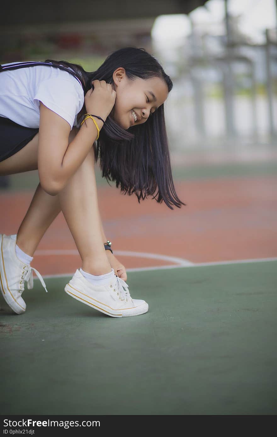 Asian teenager wearing sneaker shoes