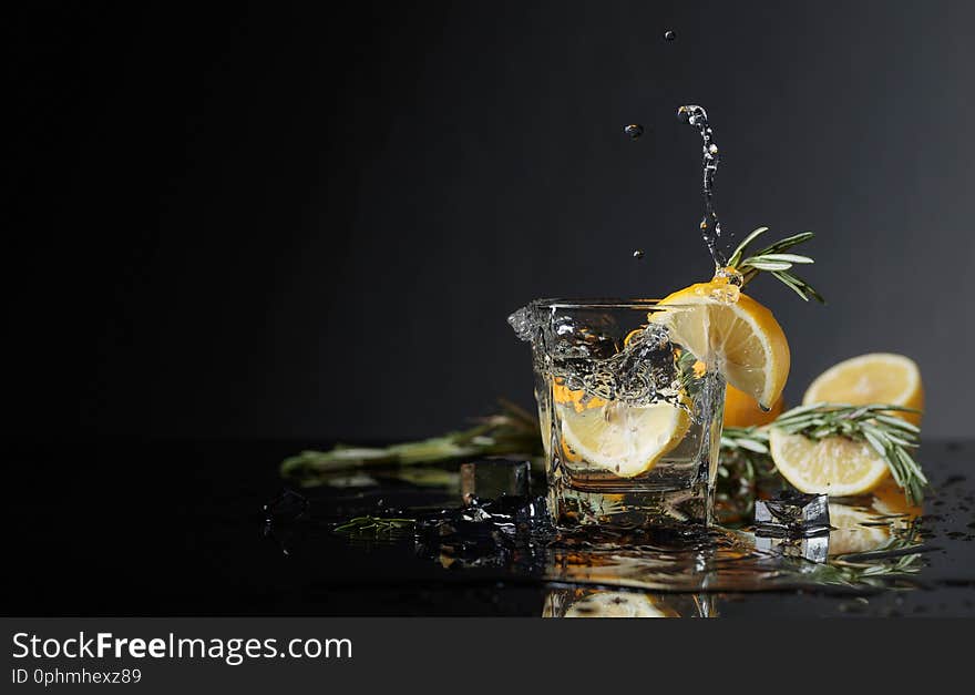 Cocktail Gin-tonic With Lemon Slices And Twigs Of Rosemary