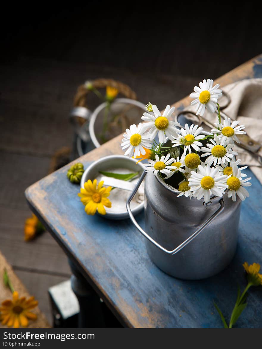 Bouquet Of Wild Chamomiles In Old Metal Can