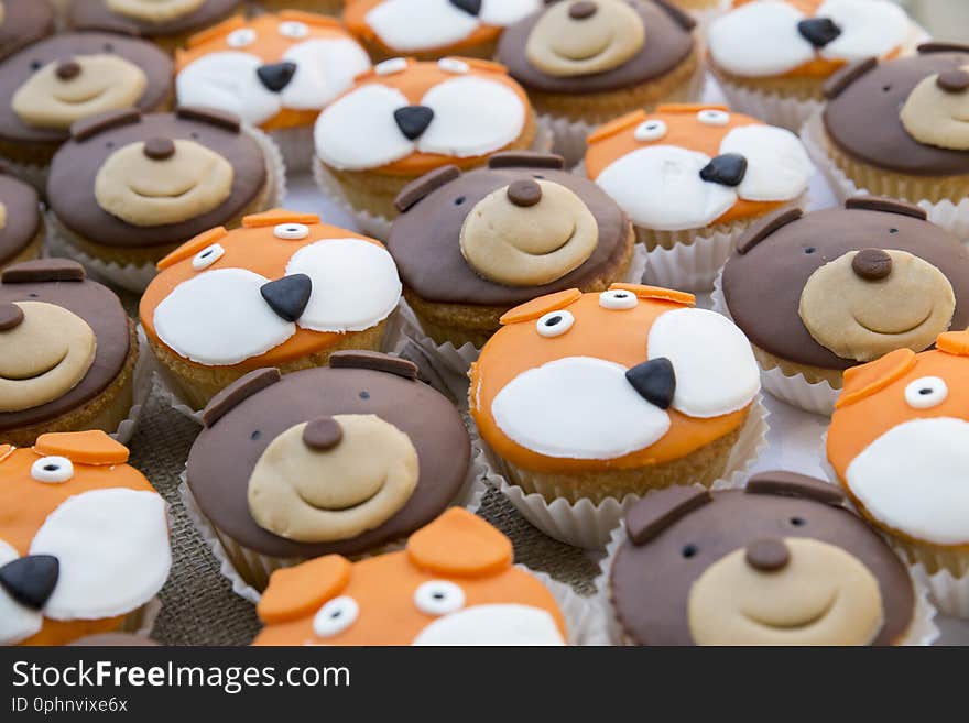 small cake with coated face of pastry paste