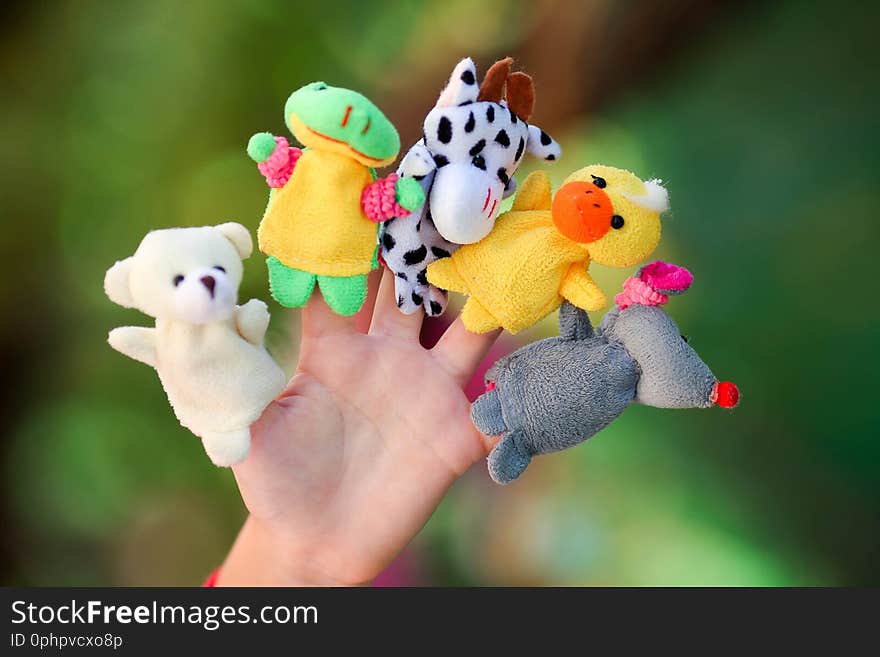 Animal dolls child playing on fingers