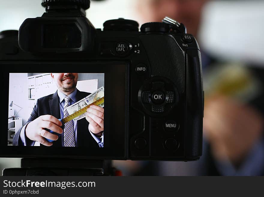 Smile businessman with measure tape records