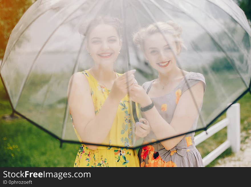 Two pretty girls in a summer park