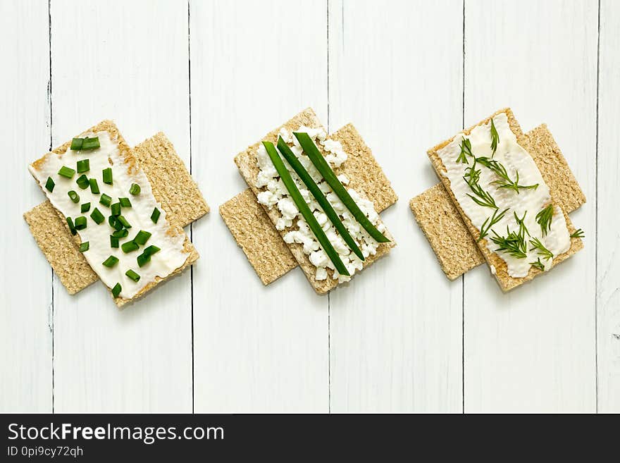 Three dietary breakfasts with cottage cheese on a white wooden table, sign of prohibition.