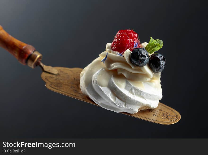 Dessert Pavlova with blueberries and raspberries