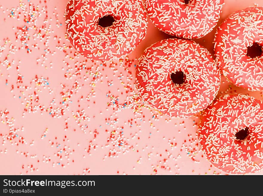 Five Coral Donuts Lying In A Corner