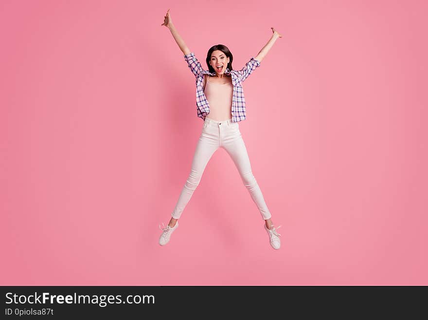 Full length body size photo funny amazing beautiful her she lady star shape figure jumping high wear shoes casual checkered plaid shirt white jeans denim clothes outfit isolated pink background.