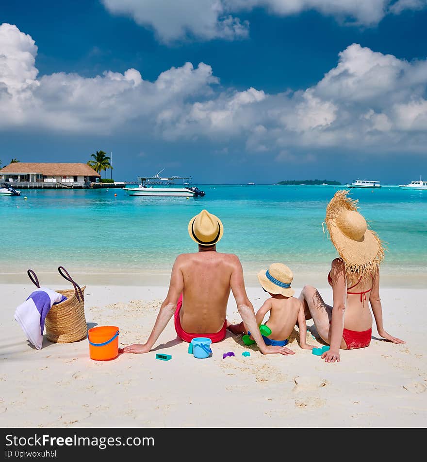 Family With Three Year Old Boy On Beach