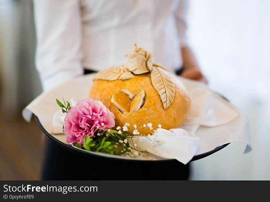 Wedding bread with salt detail on hands- traditional polish inviting to Bride and Groom. Wedding bread with salt detail on hands- traditional polish inviting to Bride and Groom