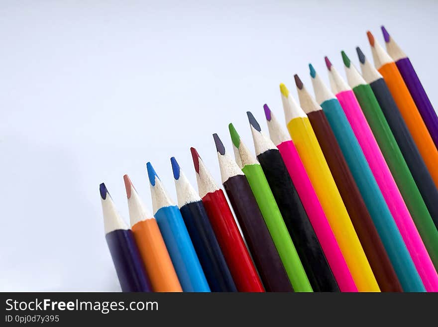 Color pencils on a white background, a line of colored pencils. Set of pencils. Children`s creativity. Drawing with pencils.