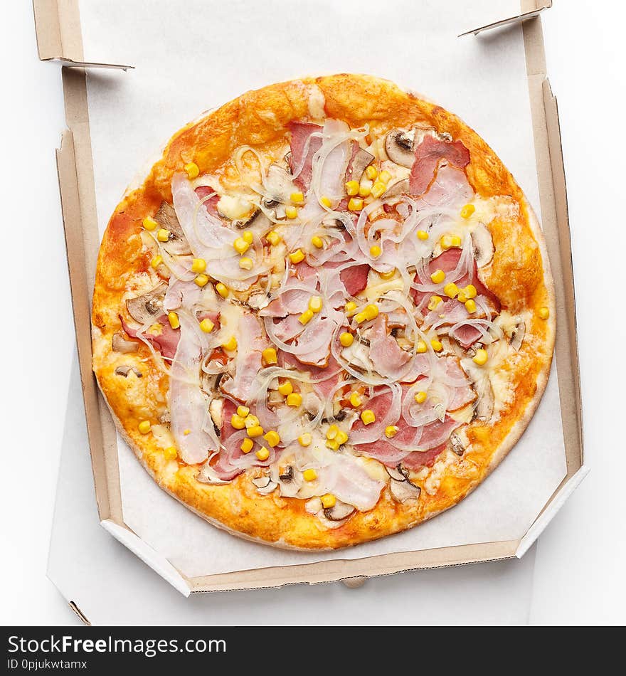 Pizza in open cardboard box on white background, top view