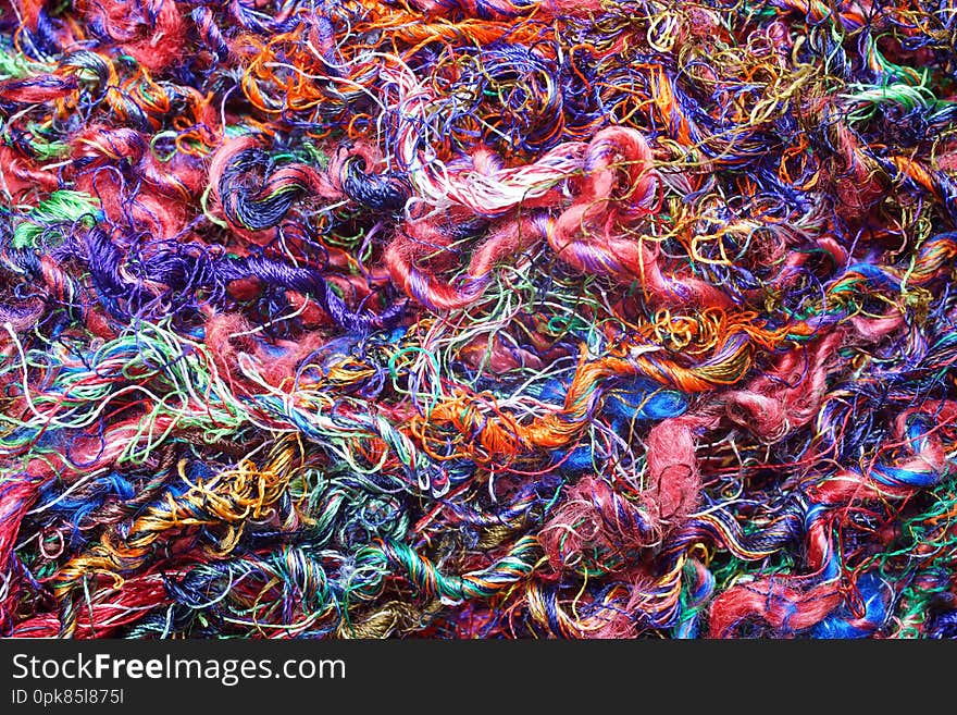 Macro close up of mixed colorful wool fibers