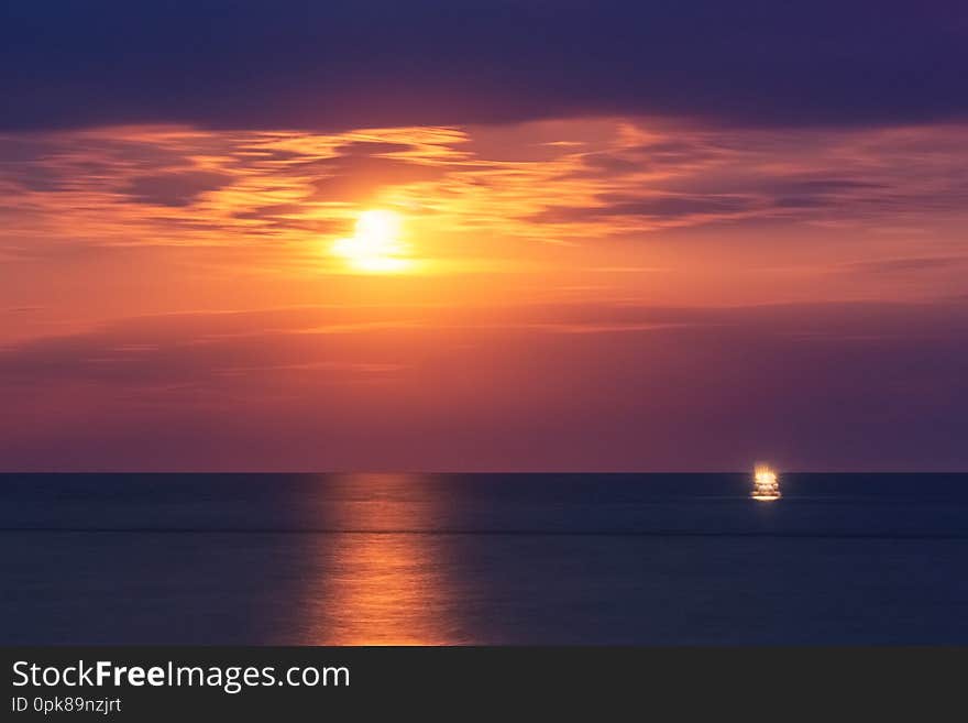 Night saescape with the Moon and the buoy, Italy