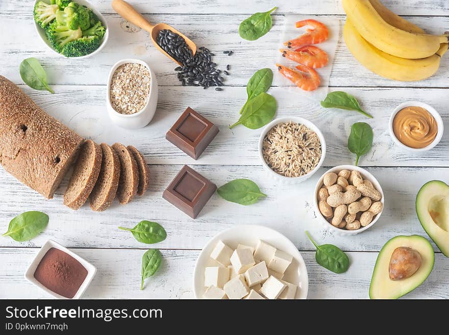 Assortment of magnesium-rich foods on the wooden background: top view. Assortment of magnesium-rich foods on the wooden background: top view