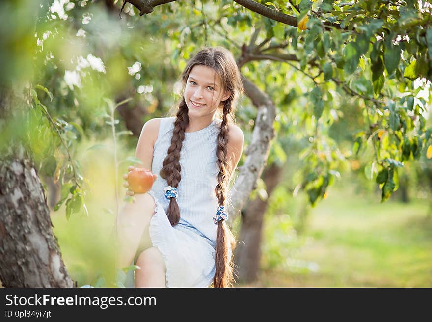 Girl with Apple in the Apple Orchard