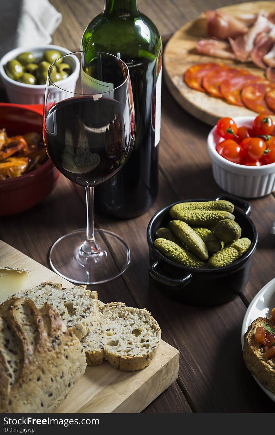 Wine And Tapas Dishes On A Wooden Table