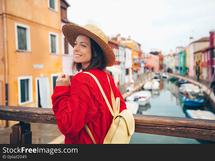 Smiling beautiful girl in a straw hat in Burano. Smiling beautiful girl in a straw hat in Burano