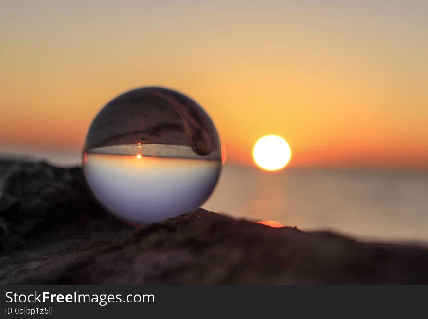 Lensball capturing the red sunrise