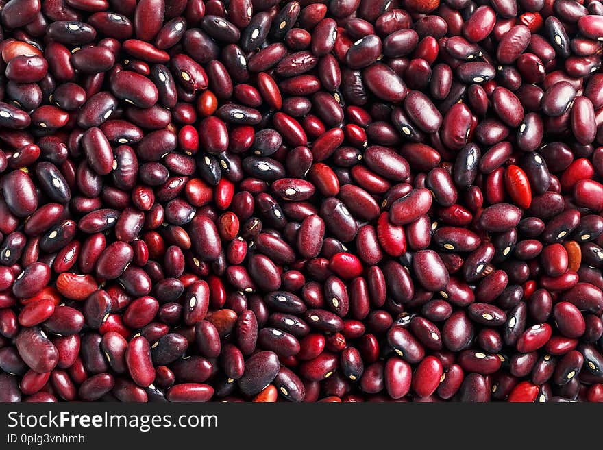 Closeup of a grain of red bean seeds. The texture of the legumes. Close up red beans background, seeds of red beans. Bean useful superfood