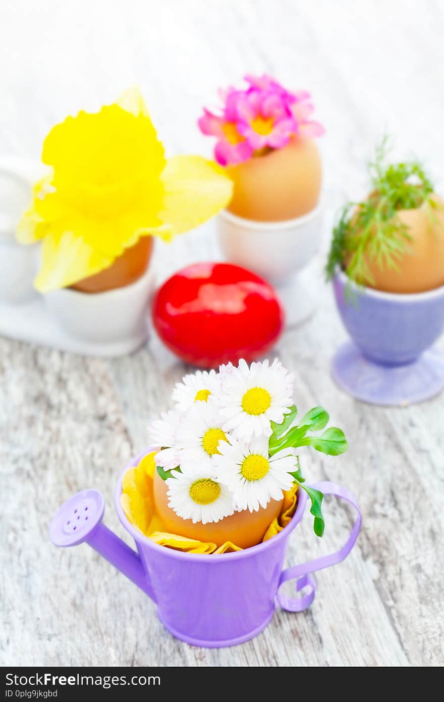 Easter decoration on table with daisies and other flowers. Easter decoration on table with daisies and other flowers