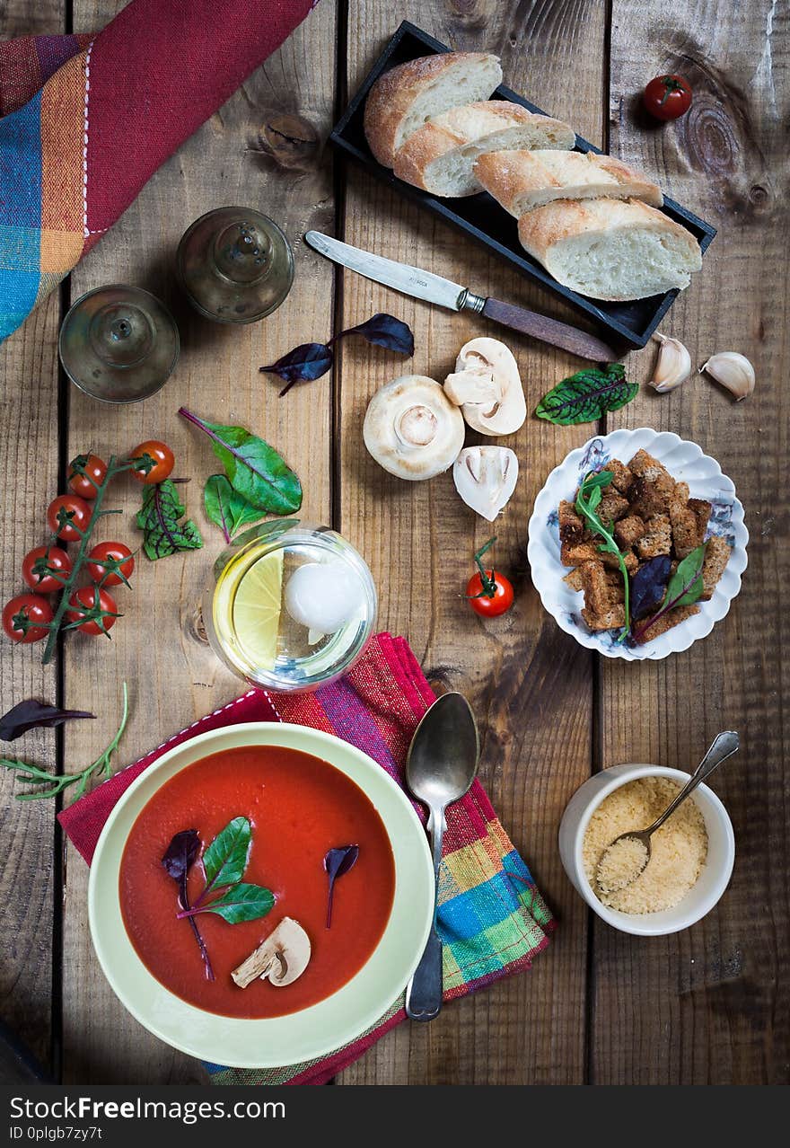 Gaspacho And Ingredients On Rustic White Table