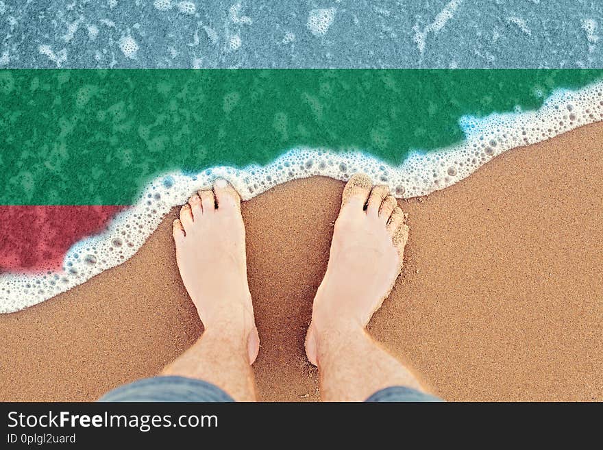 Surf on sandy beach with flag Bulgaria. Top view.