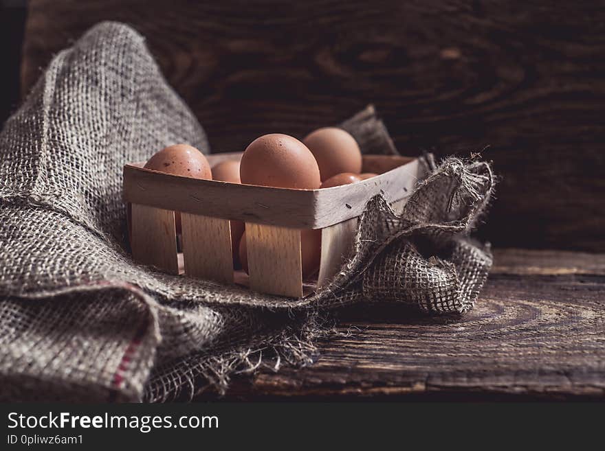 Organic farm eggs on rural wooden background