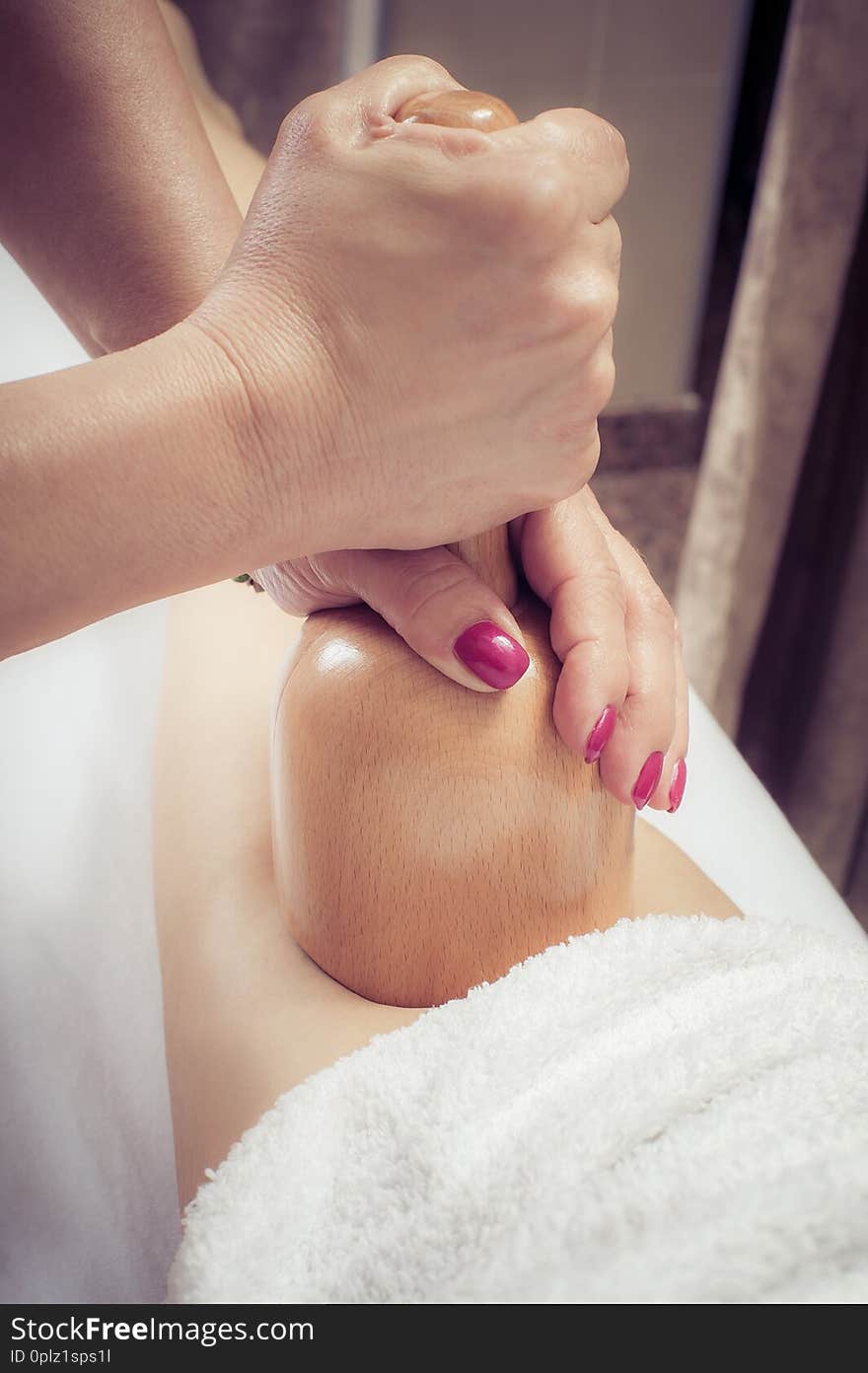 Woman on maderotherapy anticellulite massage treatment at beauty spa salon