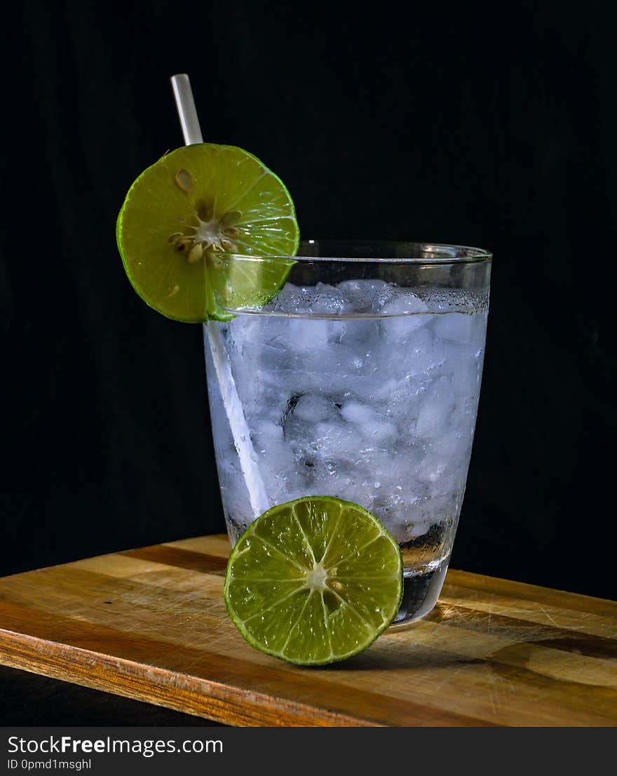 Lemon Juice On A Beautiful Black Backdrop, And Biscuits