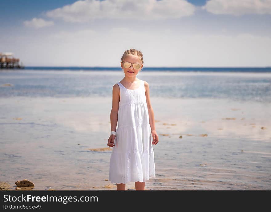 Girl standing at seashore