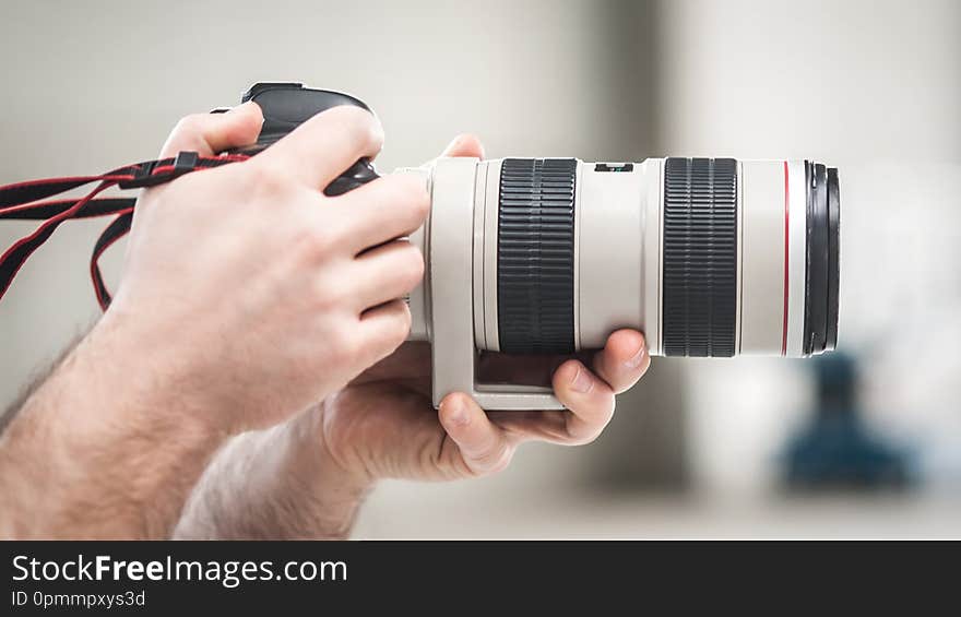 Man hand holding camera and take the photo. Selective focus